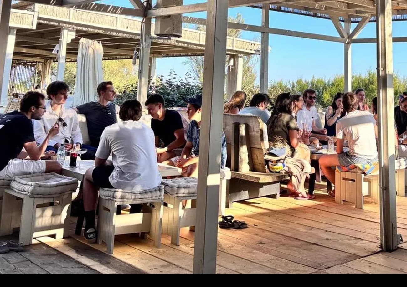 WeTransfer team at lunch on a beach terrace in Maremma